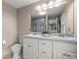 Bright bathroom features double vanity with granite countertop and decorative floral accent at 380 Ne 53Rd St, Ocala, FL 34479