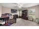 Comfortable bedroom with carpet flooring, natural lighting, ceiling fan, and ample closet space at 380 Ne 53Rd St, Ocala, FL 34479