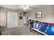 Cozy bedroom with ceiling fan, carpet flooring, and closet at 380 Ne 53Rd St, Ocala, FL 34479