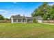 Charming single-story home with a well-manicured lawn, attached garage, and inviting front entrance at 380 Ne 53Rd St, Ocala, FL 34479