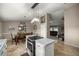 Open eat-in kitchen view highlighting granite counters, stainless appliances, island cooktop, and adjacent dining area at 380 Ne 53Rd St, Ocala, FL 34479