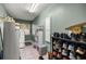 Functional laundry room with ample storage, tiled flooring, and a utility sink at 380 Ne 53Rd St, Ocala, FL 34479