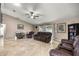 Spacious living room features tile flooring, ceiling fan and comfortable leather furniture at 380 Ne 53Rd St, Ocala, FL 34479