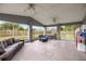 Spacious screened patio perfect for outdoor entertaining, featuring ceiling fans and comfortable seating at 380 Ne 53Rd St, Ocala, FL 34479