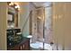 Stylish bathroom with glass-enclosed shower, granite countertops, and modern fixtures at 4026 Nw 85Th Ter, Ocala, FL 34482