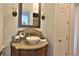 Charming bathroom featuring a vessel sink on a decorative vanity and sconce lighting at 4026 Nw 85Th Ter, Ocala, FL 34482