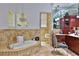 Elegant bathroom with a soaking tub, vanity, chandelier, and framed mirrors for a luxurious experience at 4026 Nw 85Th Ter, Ocala, FL 34482