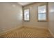 Cozy bedroom features neutral walls and a geometric patterned carpet for a comfortable space at 4026 Nw 85Th Ter, Ocala, FL 34482