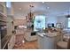 Spacious open kitchen with granite countertops, stainless steel appliances, large island, and adjacent breakfast nook at 4026 Nw 85Th Ter, Ocala, FL 34482