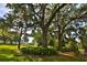 Beautiful trees with Spanish moss create a picturesque view, enhancing the lush landscaping at 4026 Nw 85Th Ter, Ocala, FL 34482