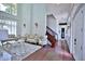 Elegant living room featuring soaring ceilings, grand windows, and ornate furnishings at 4026 Nw 85Th Ter, Ocala, FL 34482