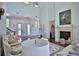 Elegant living room featuring soaring ceilings, grand windows, and ornate furnishings at 4026 Nw 85Th Ter, Ocala, FL 34482