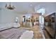 Open-concept living area with a large kitchen island, a comfortable sofa, and stylish decor at 4026 Nw 85Th Ter, Ocala, FL 34482