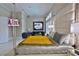 Spacious main bedroom with a luxurious bed, chandelier, TV, and sitting area, offering a relaxing retreat at 4026 Nw 85Th Ter, Ocala, FL 34482