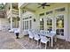 Covered patio with a dining table, chairs, and a view of the backyard and pool at 4026 Nw 85Th Ter, Ocala, FL 34482