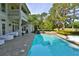 Luxury outdoor living featuring a pool, spa, and patio with ample seating at 4026 Nw 85Th Ter, Ocala, FL 34482