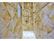Luxury shower with multiple showerheads, built-in shelving, and decorative tiling for a spa-like experience at 4026 Nw 85Th Ter, Ocala, FL 34482