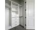 Closet with white shelving and drawers providing efficient storage solutions at 4370 County Road 121D, Wildwood, FL 34785