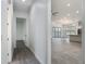 Hallway showcasing open floorplan into living room with hardwood floors and natural light at 4370 County Road 121D, Wildwood, FL 34785