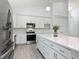 Beautiful kitchen with stainless steel appliances, quartz countertops, decorative backsplash and updated cabinetry at 4370 County Road 121D, Wildwood, FL 34785