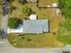 High angle view of a well maintained home with a fenced yard and mature trees, nestled in a quiet neighborhood at 4880 Ne 23 Ave, Ocala, FL 34479
