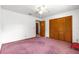 Bedroom with carpet floor, closet, and ceiling fan at 4880 Ne 23 Ave, Ocala, FL 34479