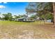 A spacious home featuring a well-maintained yard at 4880 Ne 23 Ave, Ocala, FL 34479