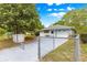 Cozy home featuring fenced yard and inviting curb appeal at 4880 Ne 23 Ave, Ocala, FL 34479