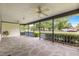 The covered front porch features a decorative concrete floor, ceiling fans, and shade at 4880 Ne 23 Ave, Ocala, FL 34479