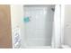 Clean bathroom featuring a shower-tub combination with a white shower curtain and basic fixtures at 5083 Se 26Th St, Ocala, FL 34480