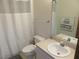 Clean bathroom featuring a white vanity, toilet, and tub with a neutral color scheme and minimalist design at 5083 Se 26Th St, Ocala, FL 34480