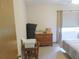 Bedroom featuring a dresser and bed by a window at 5083 Se 26Th St, Ocala, FL 34480