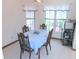 Cozy dining area with natural light and a well appointed table at 5083 Se 26Th St, Ocala, FL 34480
