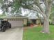Charming single-story home with a two-car garage and well-maintained landscaping at 5083 Se 26Th St, Ocala, FL 34480