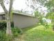 Exterior view of a single-story home with lush, green lawn and well-maintained landscaping at 5083 Se 26Th St, Ocala, FL 34480