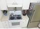 Functional kitchen with stainless steel refrigerator and white oven range at 5083 Se 26Th St, Ocala, FL 34480