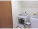 Bright laundry room featuring modern appliances and convenient shelving for storage at 5083 Se 26Th St, Ocala, FL 34480