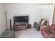 Cozy living room setup with a TV, speakers, and comfortable seating arrangement at 5083 Se 26Th St, Ocala, FL 34480