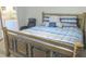 A comforting main bedroom featuring carpet, a wooden bed frame and a cozy chair at 5083 Se 26Th St, Ocala, FL 34480