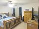 Comfortable main bedroom features a ceiling fan and wood furnishings at 5083 Se 26Th St, Ocala, FL 34480