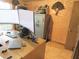Office space showcasing monitors, desk setup, and a visible safe at 5083 Se 26Th St, Ocala, FL 34480