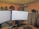 Well-equipped office space features dual monitors, wooden desk, and rustic decor at 5083 Se 26Th St, Ocala, FL 34480