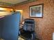 Comfortable office space featuring textured walls, a large monitor, and an ergonomic black chair at 5083 Se 26Th St, Ocala, FL 34480