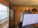 Office space shows textured walls, a large monitor, and natural light from a window at 5083 Se 26Th St, Ocala, FL 34480