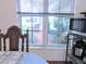A window shows a lovely bench and manicured landscape with foliage at 5083 Se 26Th St, Ocala, FL 34480