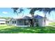 A view of the back exterior featuring a screened patio and large yard at 5110 Nw 19Th Pl, Ocala, FL 34482