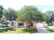 Charming single-story home with an attached garage and a well-manicured lawn at 5110 Nw 19Th Pl, Ocala, FL 34482