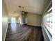 Spacious living room with vaulted ceilings and laminate floors at 5110 Nw 19Th Pl, Ocala, FL 34482
