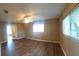 The primary bedroom features a large window and laminate flooring at 5110 Nw 19Th Pl, Ocala, FL 34482