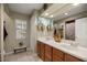 Bathroom featuring double sinks, wood cabinets, and tile floors at 5174 Se 41St Ave, Ocala, FL 34480